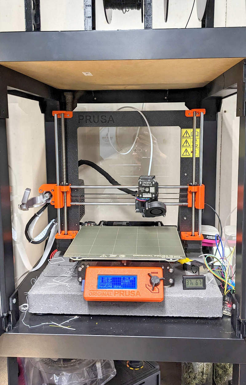A picture of the 3D printer inside the enclosure.