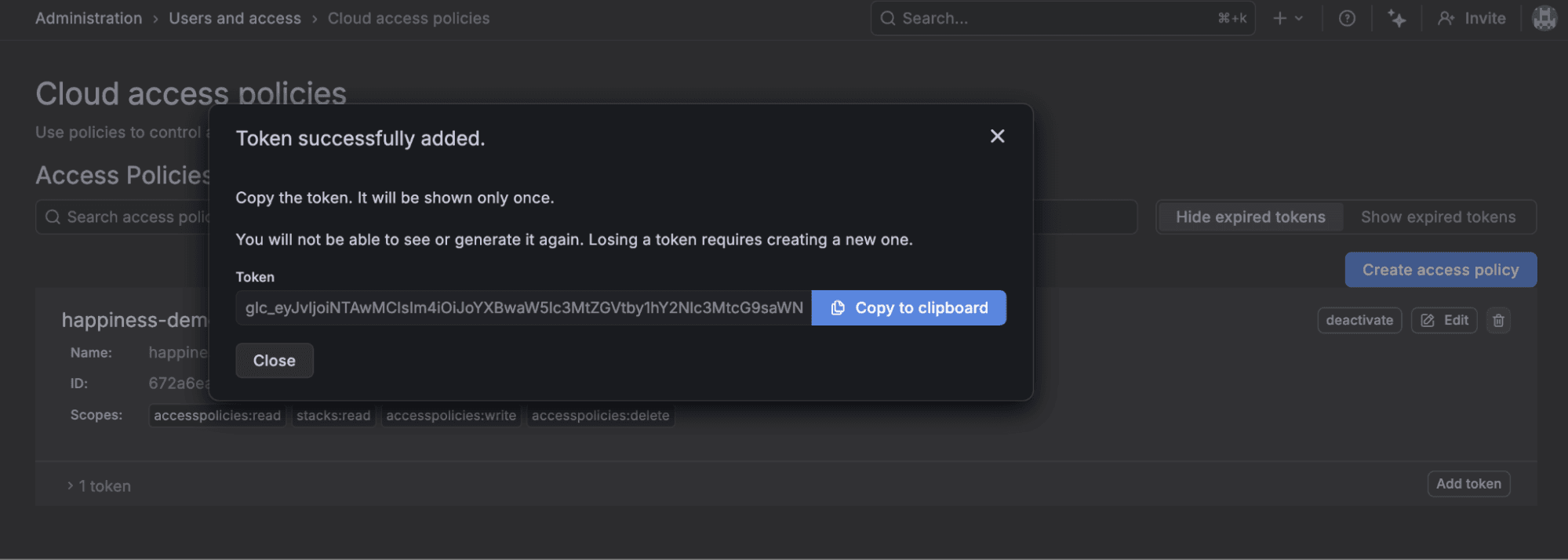 A screenshot of the Grafana Cloud UI indicating a service account token has been successfully added