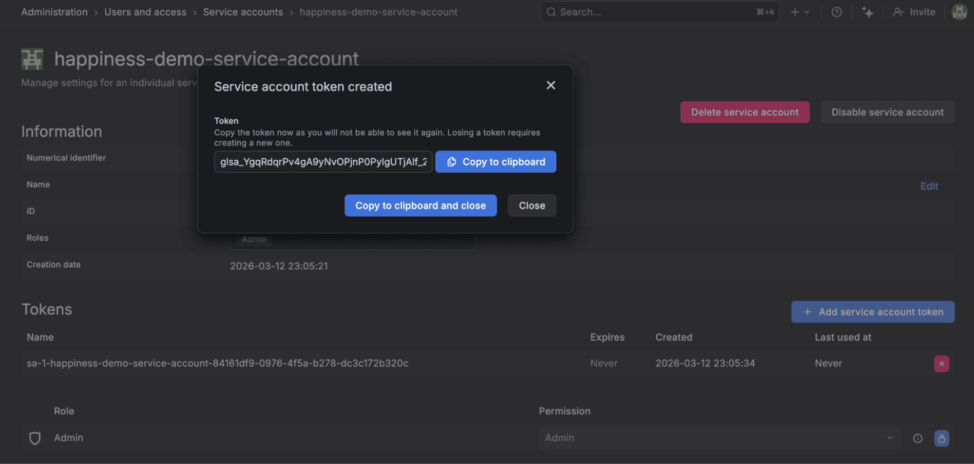 A screenshot of the Grafana Cloud UI indicating a service account token has been created