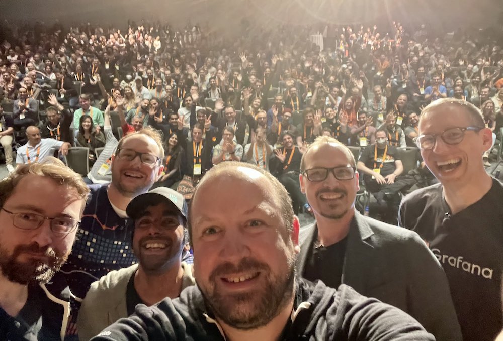 Live from GrafanaFest! (From left) Torkel Ödegaard, Anthony Woods, Raj Dutt, Tom Wilkie, Mat Ryer, and Matt Toback end their special podcast recording with a selfie on stage in front of 600+ Grafanistas in Whistler, British Columbia in May 2022.
